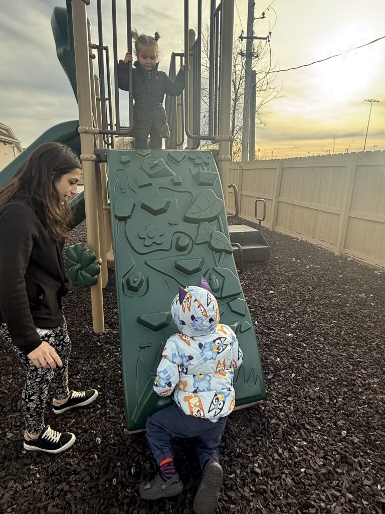 two children on playground equipment